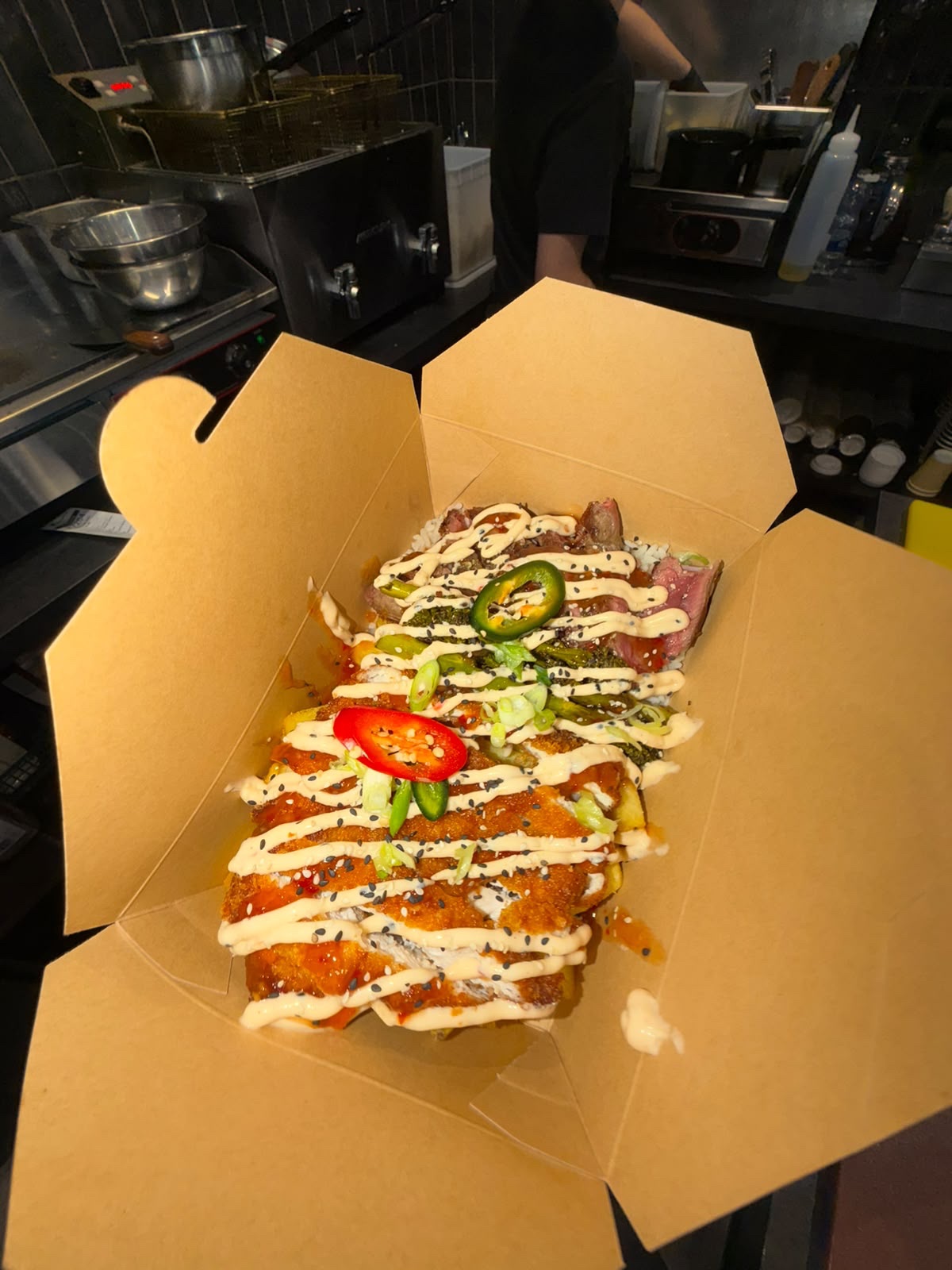 Crispy katsu chicken and steak box with rice, broccoli and chilli