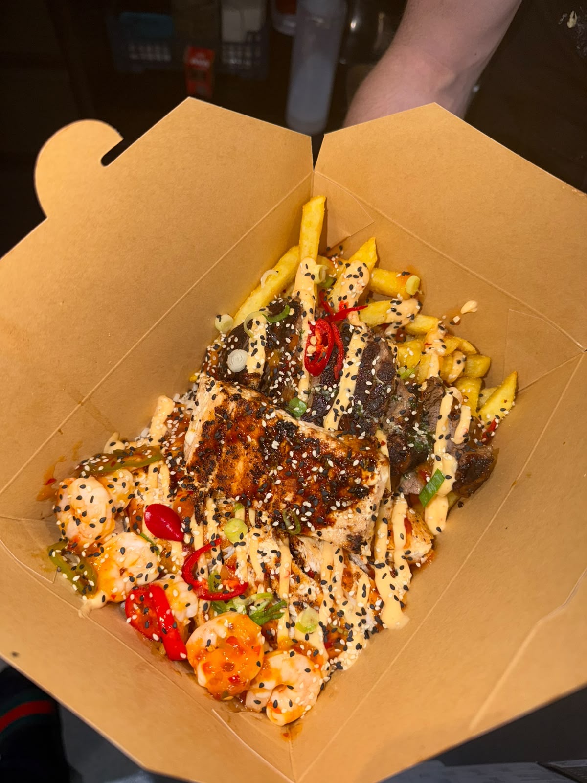 Loaded fries topped with salmon, steak, prawns, chilli and spicy mayo